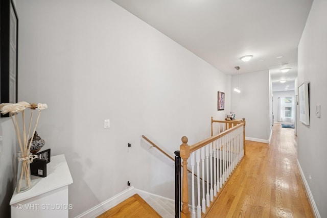 6122 S Greenwood Ave Unit 1S, Chicago, IL 60637 - hallway featuring an upstairs landing, light wood finished floors, and baseboards