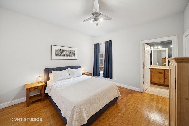 6122 S Greenwood Ave Unit 1S, Chicago, IL 60637 - bedroom featuring light wood-style floors, baseboards, a sink, and connected bathroom