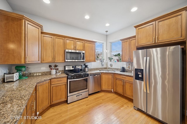 6122 S Greenwood Ave Unit 1S, Chicago, IL 60637 - kitchen with appliances with stainless steel finishes, a sink, brown cabinets, and recessed lighting