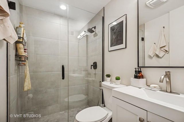 full bath featuring toilet, vanity, visible vents, recessed lighting, and a shower stall