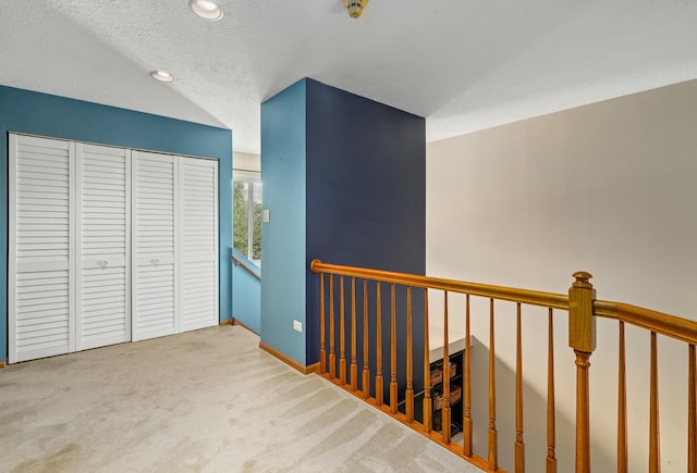 4232 Caribou Ct, Joliet, IL 60431 - corridor featuring an upstairs landing, carpet floors, recessed lighting, and a textured ceiling