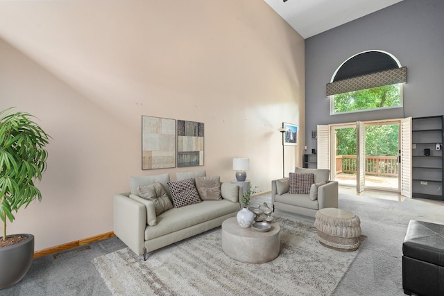 4232 Caribou Ct, Joliet, IL 60431 - carpeted living area with a towering ceiling and baseboards