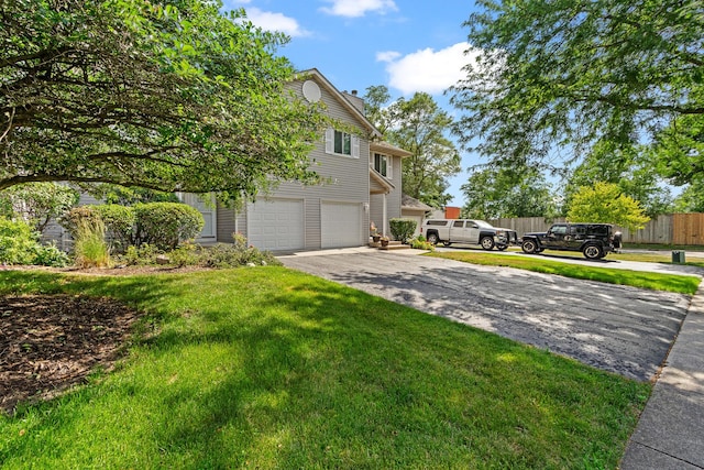 4232 Caribou Ct, Joliet, IL 60431 - view of property exterior featuring driveway, an attached garage, and a chimney