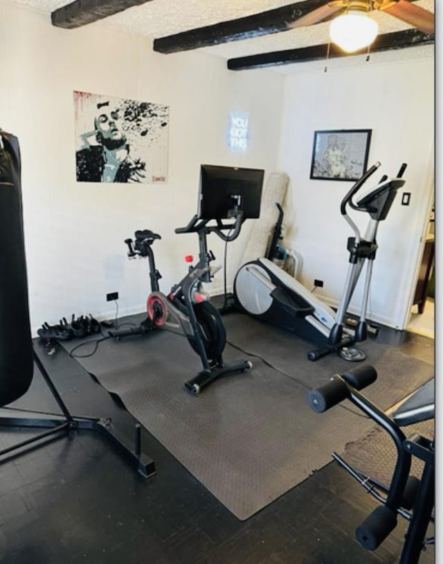 exercise room with ceiling fan