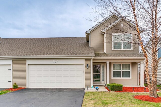 267 Maryland Ln, Pingree Grove, IL 60140 - view of front of home with aphalt driveway, a front yard, a shingled roof, and a garage