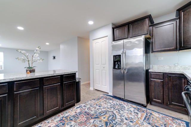 267 Maryland Ln, Pingree Grove, IL 60140 - kitchen with light wood-style flooring, dark brown cabinetry, recessed lighting, light stone counters, and stainless steel refrigerator with ice dispenser