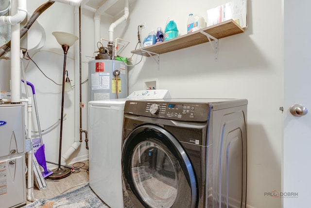 267 Maryland Ln, Pingree Grove, IL 60140 - washroom featuring washing machine and dryer, light wood-style flooring, water heater, and laundry area