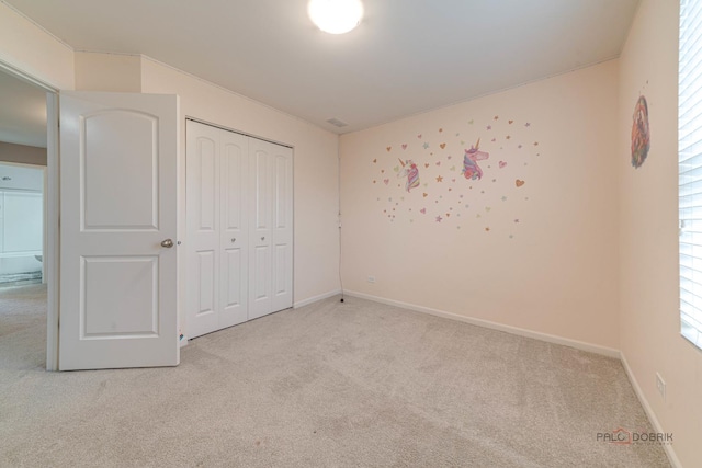 267 Maryland Ln, Pingree Grove, IL 60140 - unfurnished bedroom with carpet, a closet, and baseboards
