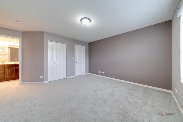 267 Maryland Ln, Pingree Grove, IL 60140 - unfurnished bedroom with a closet, baseboards, light carpet, and ensuite bathroom