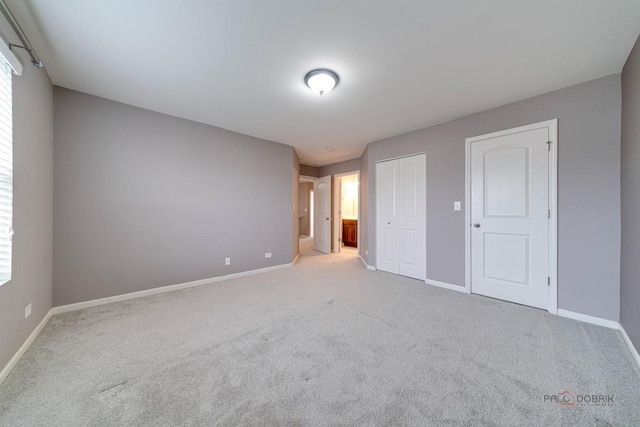 267 Maryland Ln, Pingree Grove, IL 60140 - unfurnished bedroom featuring ensuite bath, baseboards, carpet floors, and a closet