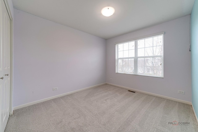 267 Maryland Ln, Pingree Grove, IL 60140 - empty room with visible vents, baseboards, and light carpet