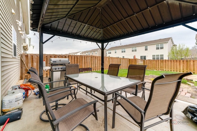 267 Maryland Ln, Pingree Grove, IL 60140 - view of patio featuring a fenced backyard, outdoor dining area, and a grill