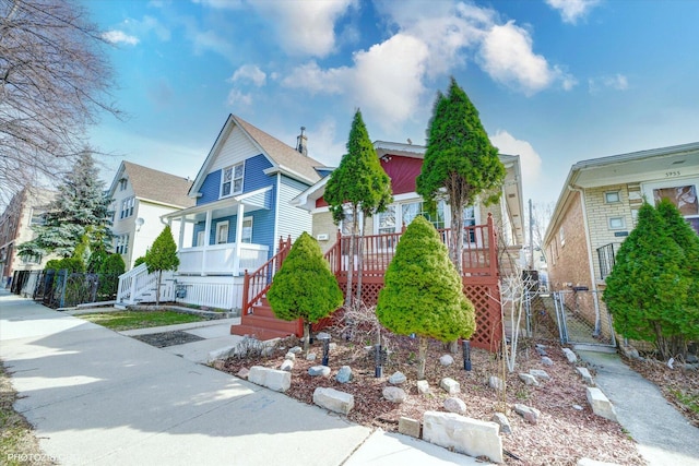 view of front facade featuring fence