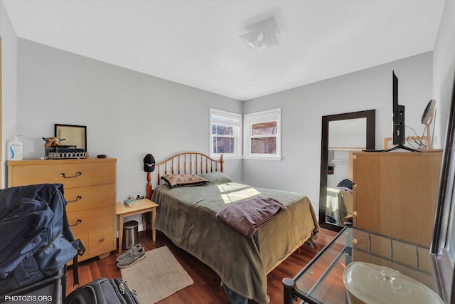 bedroom with wood finished floors