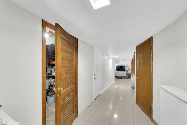 corridor with light tile patterned floors