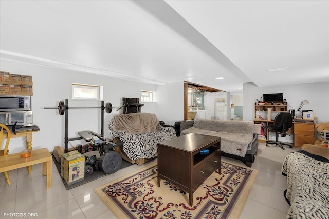 living room with light tile patterned flooring