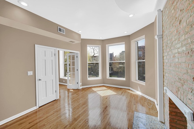 6547 S Woodlawn Ave Unit 2, Chicago, IL 60637 - entryway with baseboards, a healthy amount of sunlight, and light wood-style flooring