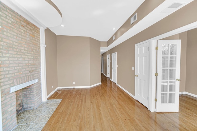 6547 S Woodlawn Ave Unit 2, Chicago, IL 60637 - unfurnished living room featuring baseboards, wood finished floors, and visible vents