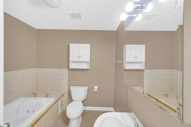 6547 S Woodlawn Ave Unit 2, Chicago, IL 60637 - bathroom with a whirlpool tub, baseboards, toilet, tile patterned flooring, and visible vents