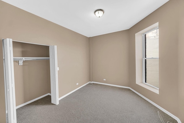 6547 S Woodlawn Ave Unit 2, Chicago, IL 60637 - unfurnished bedroom with baseboards, a closet, and carpet