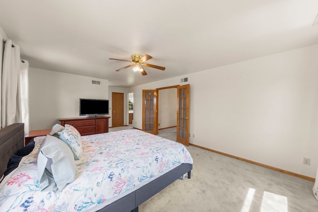2398 S Williamsburg Dr, Plainfield, IL 60586 - bedroom featuring french doors, light colored carpet, and ceiling fan