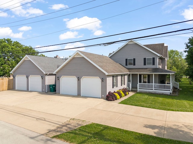 2398 S Williamsburg Dr, Plainfield, IL 60586 - view of front facade featuring covered porch, an attached garage, driveway, and roof with shingles