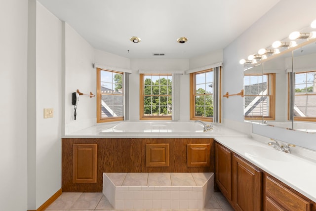2398 S Williamsburg Dr, Plainfield, IL 60586 - bathroom with a garden tub, vanity, and tile patterned flooring
