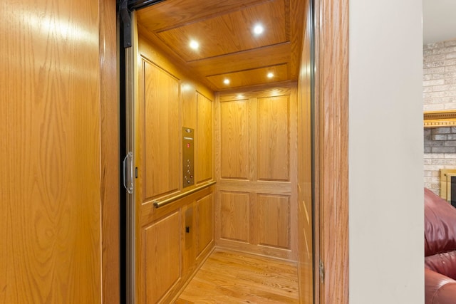 2398 S Williamsburg Dr, Plainfield, IL 60586 - elevator with wood finished floors and recessed lighting