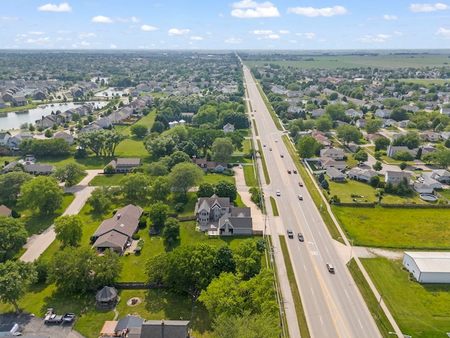 2398 S Williamsburg Dr, Plainfield, IL 60586 - aerial view of residential area featuring a main thoroughfare and a large body of water
