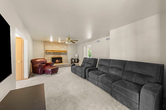 2398 S Williamsburg Dr, Plainfield, IL 60586 - carpeted living room with a brick fireplace and a ceiling fan
