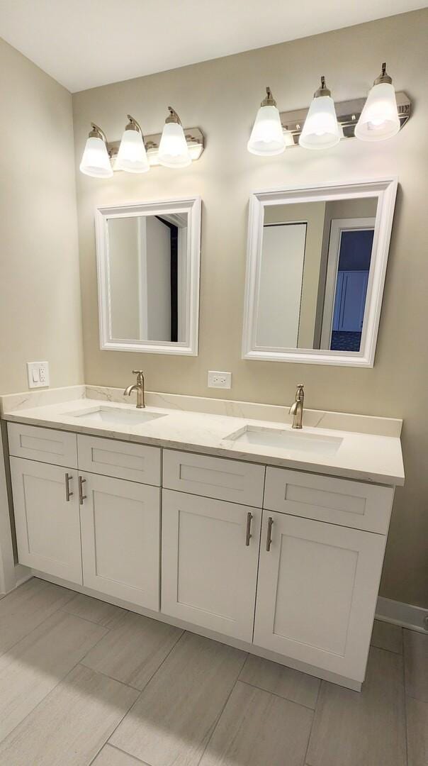 bathroom featuring double vanity and a sink