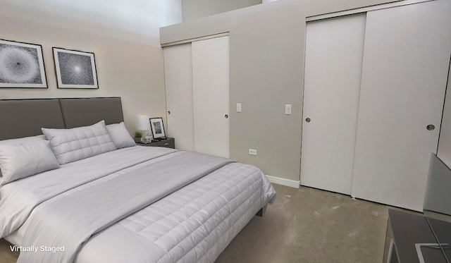 bedroom featuring multiple closets, carpet flooring, and baseboards