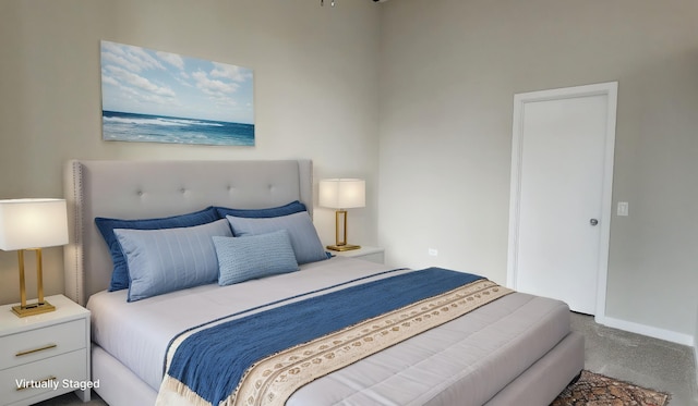 bedroom with baseboards and carpet flooring