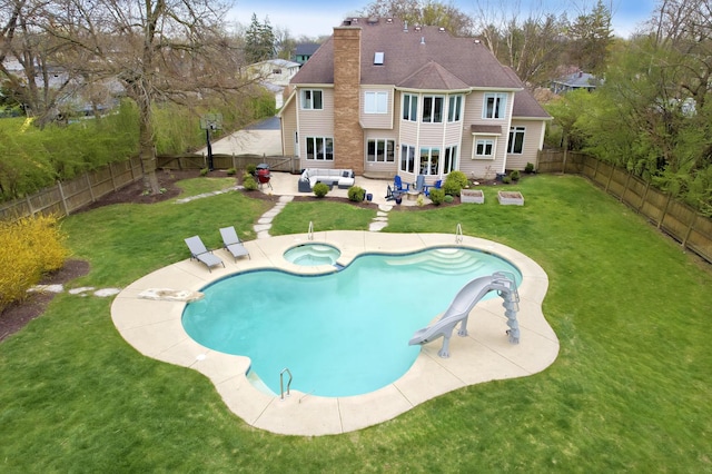 view of swimming pool with an outdoor living space, a fenced backyard, a water slide, and a yard