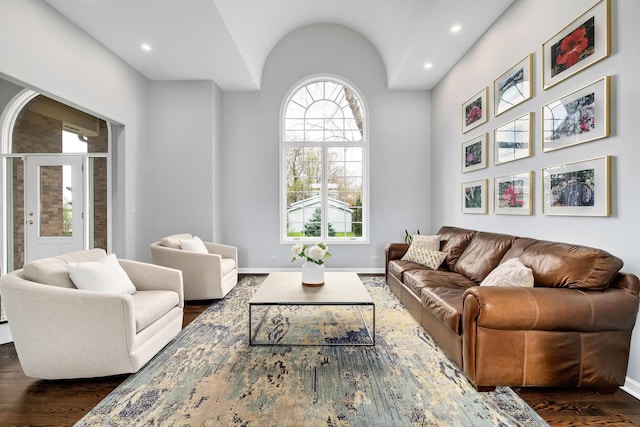 living area with recessed lighting, baseboards, and dark wood-style floors