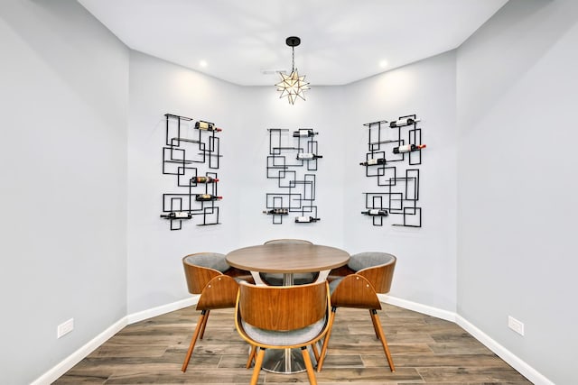dining area with recessed lighting, dark wood finished floors, and baseboards