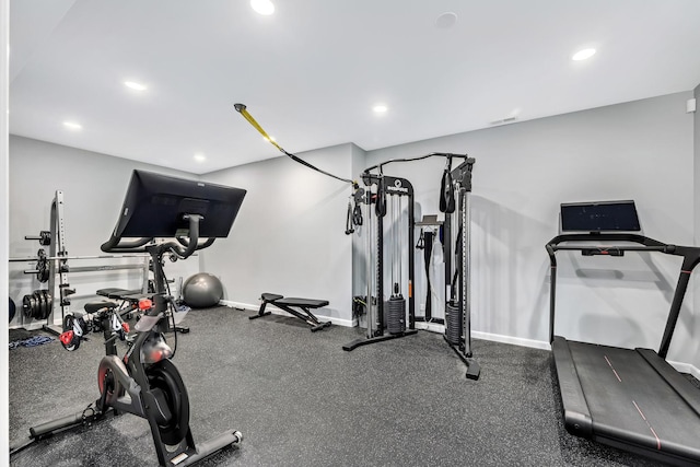workout area featuring visible vents, baseboards, and recessed lighting