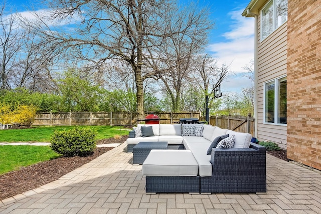 view of patio / terrace with an outdoor living space and a fenced backyard