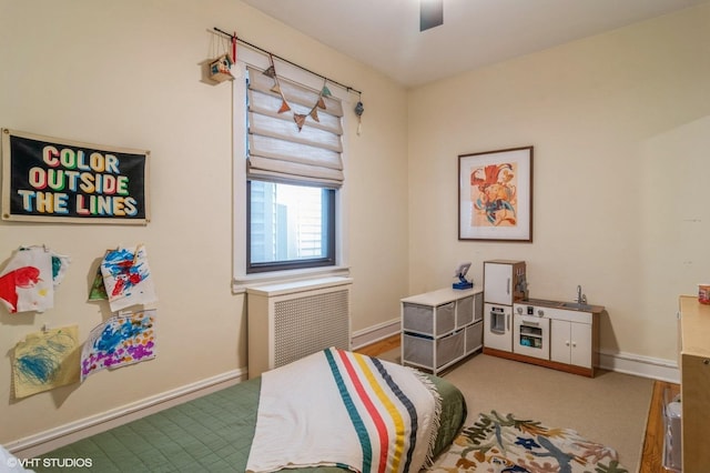 bedroom with a ceiling fan and baseboards
