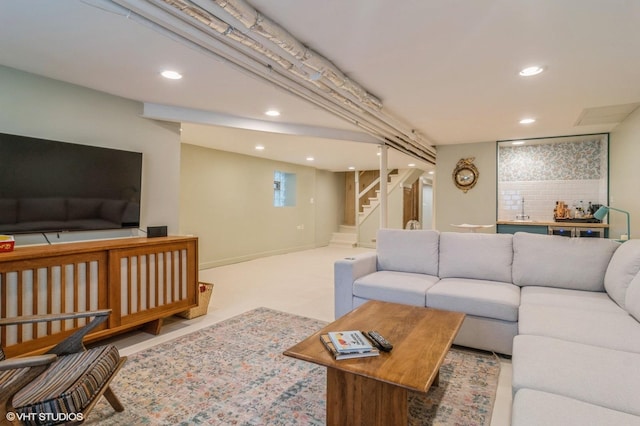 living area featuring recessed lighting and stairway