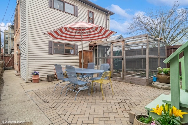view of patio / terrace featuring outdoor dining area and a fenced backyard
