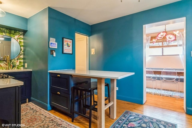 interior space with light wood-style floors and baseboards