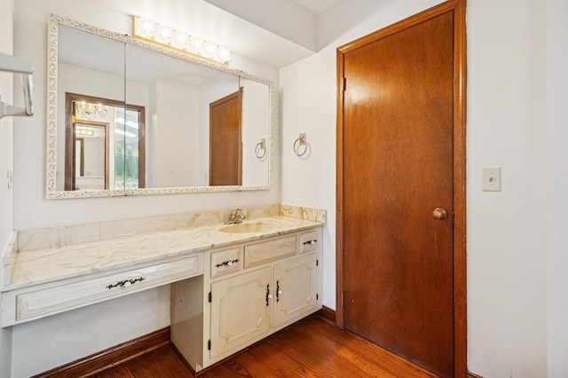 bathroom with vanity and wood finished floors