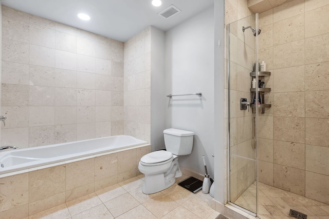 full bathroom featuring visible vents, a stall shower, a relaxing tiled tub, tile patterned floors, and toilet