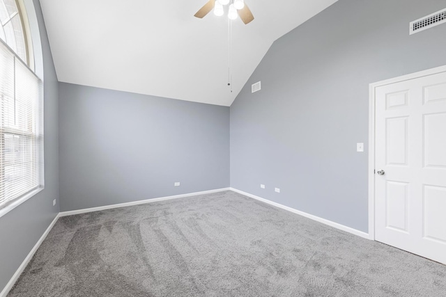 additional living space with carpet flooring, ceiling fan, visible vents, baseboards, and lofted ceiling