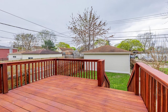 wooden deck featuring a lawn and a fenced backyard