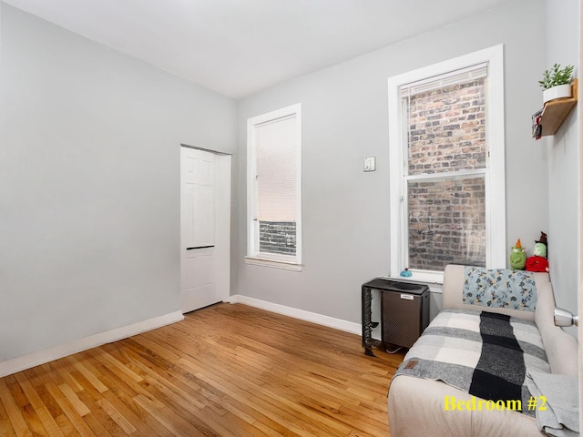 bedroom with baseboards and light wood-style floors