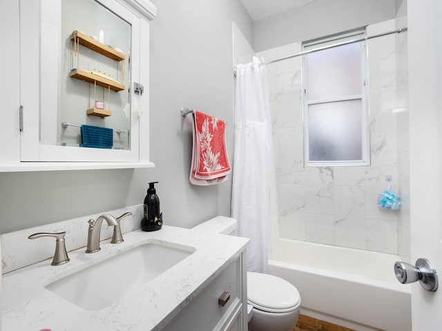 bathroom featuring shower / bath combo with shower curtain, vanity, and toilet