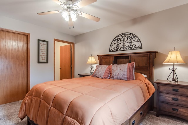 bedroom featuring a ceiling fan and light colored carpet