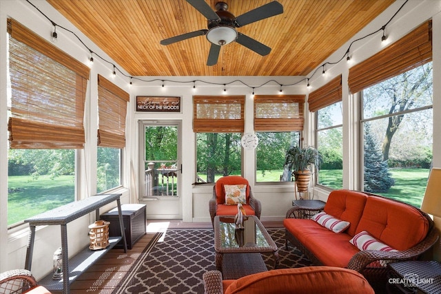 sunroom with rail lighting and wooden ceiling